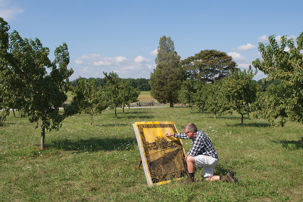 Mark Mahosky painting in the Peach Orchard